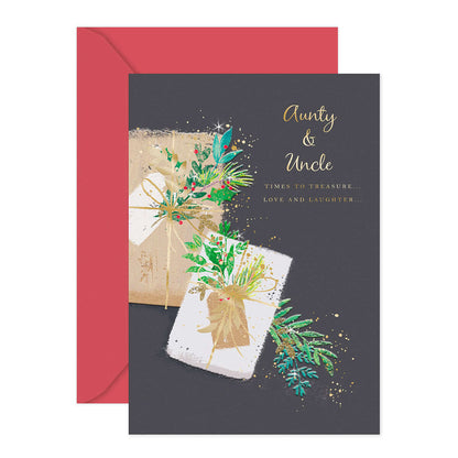 Hallmark Christmas Card - Aunty & Uncle, featuring gold foil text, colourful gift illustration, and a red envelope.