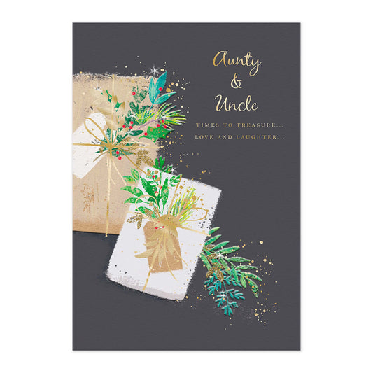Hallmark Christmas Card - Aunty & Uncle with gold foil text and festive illustration of gift-wrapped presents on a dark background.