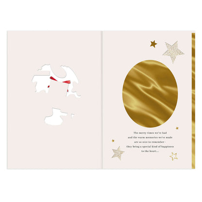 Hallmark Christmas card - Lovely Daughter, inside view featuring gold foil oval, textured paper, and decorative stars.