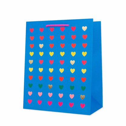 Hallmark Medium Gift Bag - Neon Hearts, medium sized, vibrant blue with multicoloured heart illustrations and hot pink cord handles.