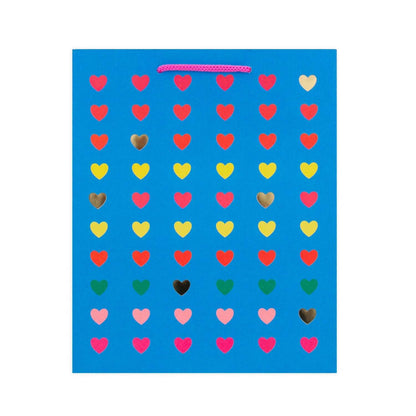 Hallmark Medium Gift Bag - Neon Hearts design featuring colourful love hearts and gold foil on a bright blue background with hot pink cord handles.