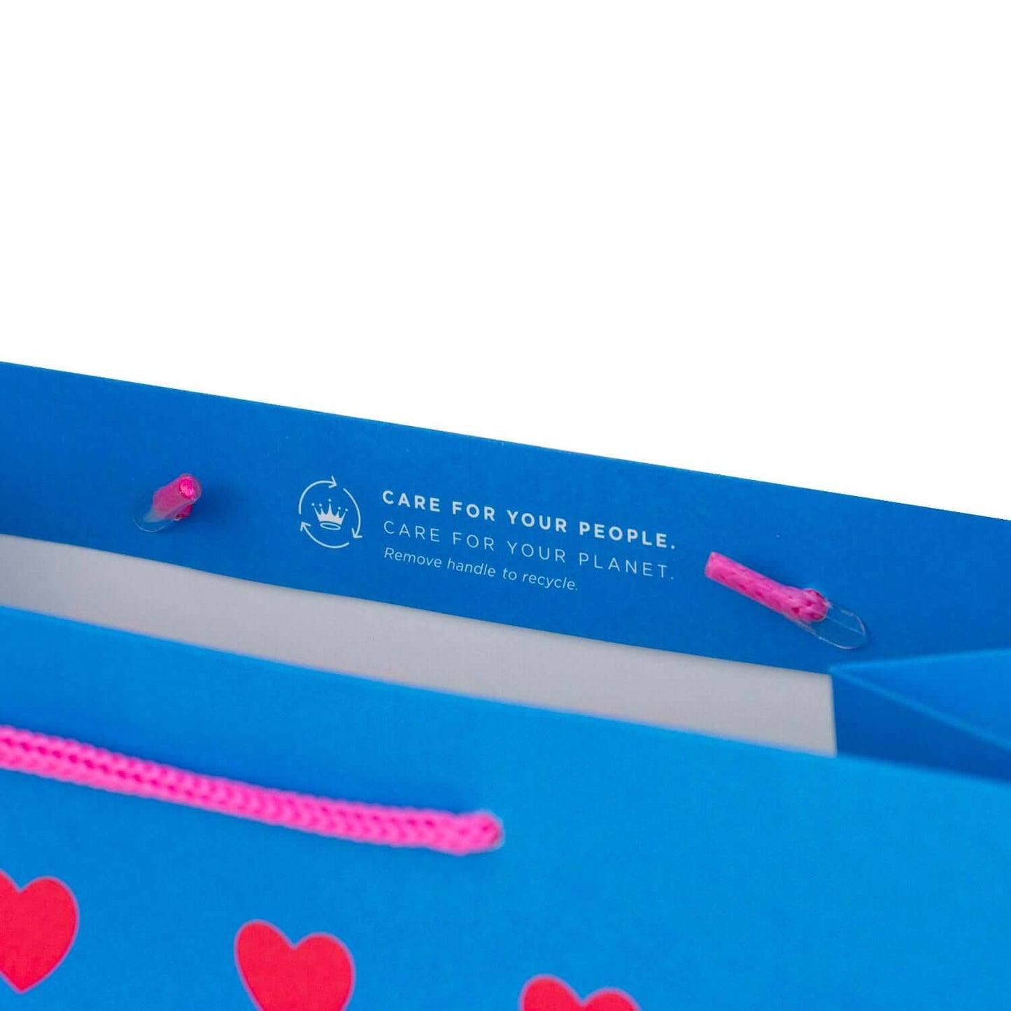 Hallmark Large Gift Bag - Neon Hearts featuring hot pink cord handles and recycling instructions on a bright blue background.