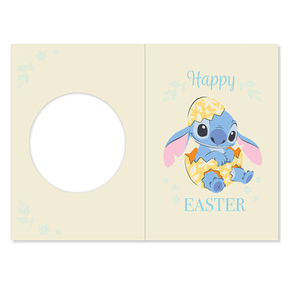 Easter greeting card with cartoon character in an egg, 'Happy Easter' text, on a light yellow background.