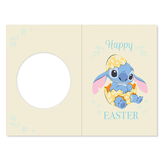 Easter greeting card with cartoon character in an egg, 'Happy Easter' text, on a light yellow background.