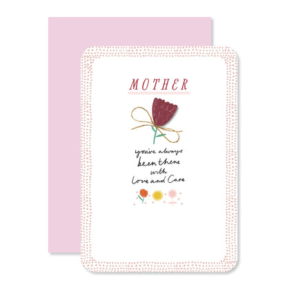 Hallmark Mother's Day card - Love & Care featuring embossed flower design and heartfelt message, flat lay with pink envelope.