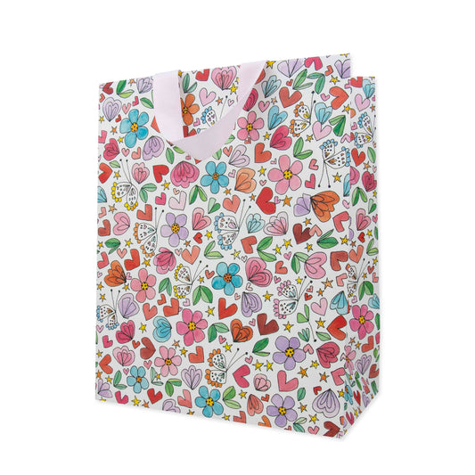 Hallmark x Love, Meredith Large Gift Bag - Butterflies, Hearts, Stars & Flowers, large size with colourful floral and heart patterns, angled view