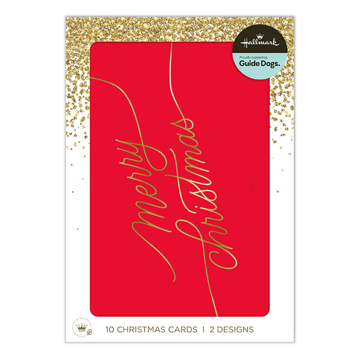 Hallmark Guide Dogs Christmas card set packaging, featuring a red card with gold foil 'Merry Christmas' script and a gold glitter border on a white backing card.