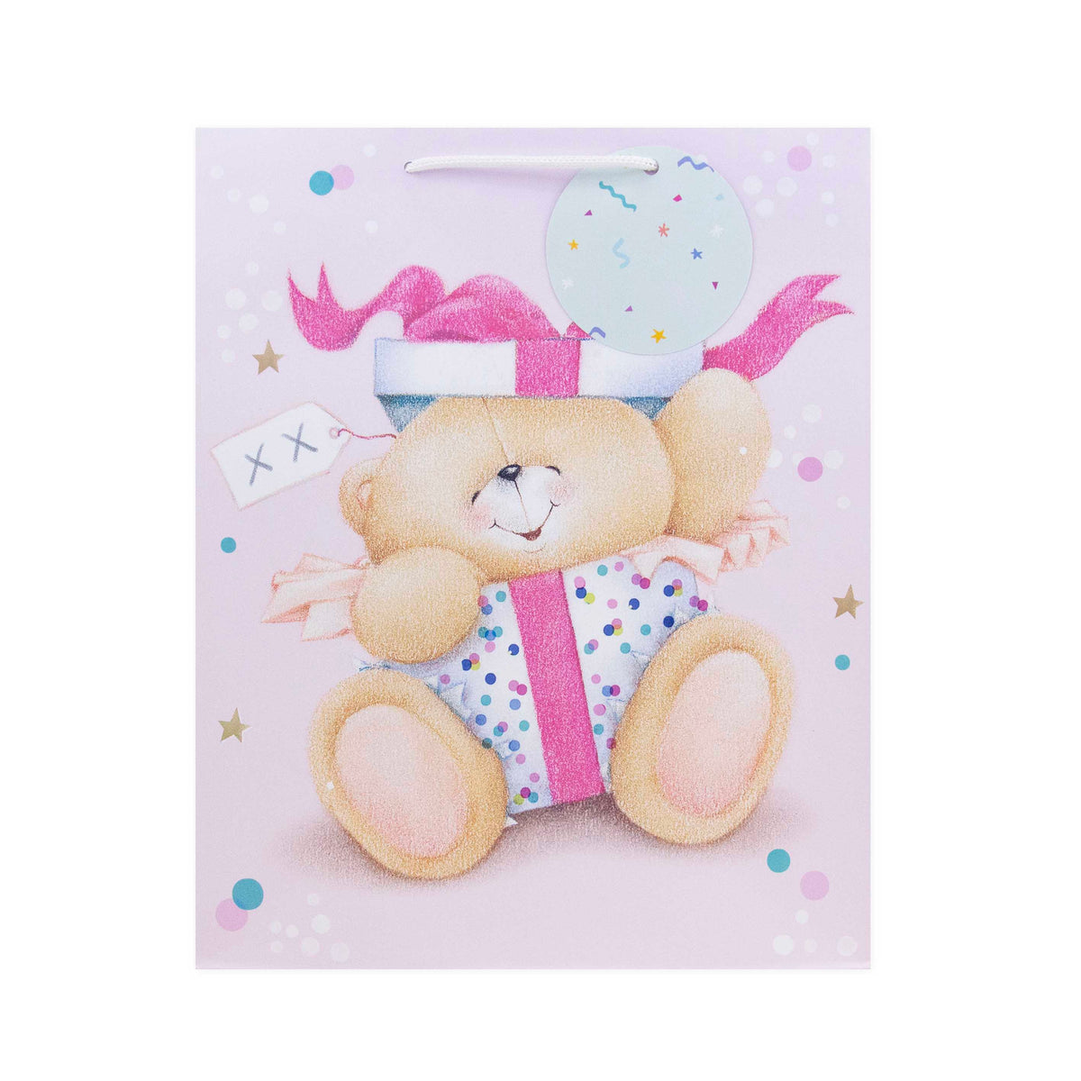 A pastel gift bag featuring a teddy bear holding a wrapped present, with a pink ribbon, a light blue balloon, and scattered pastel dots on a pale pink background.
