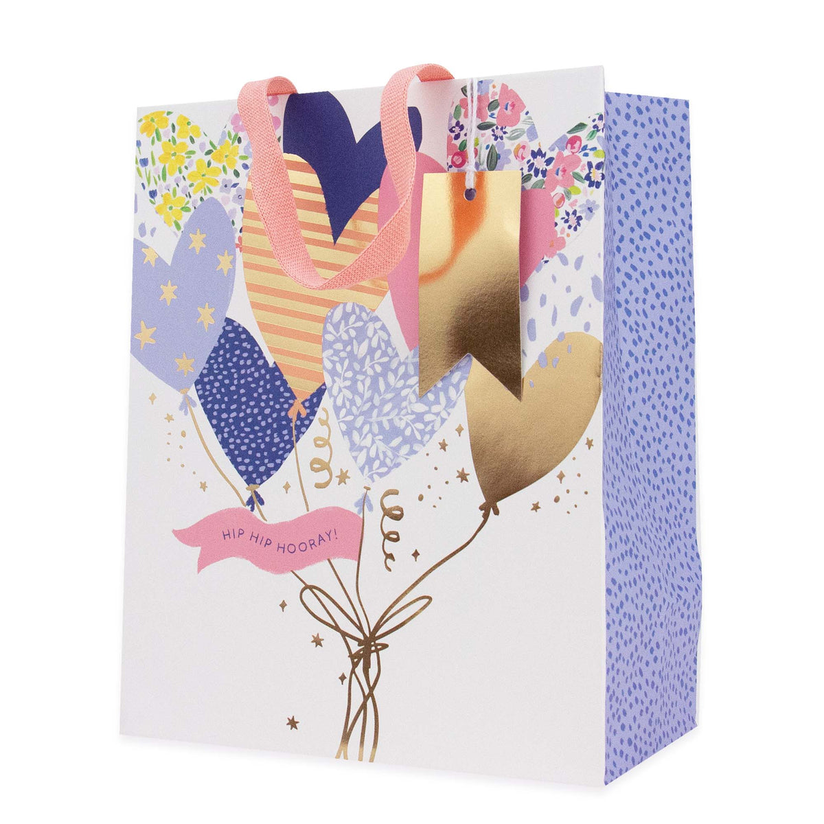 A decorative gift bag with a white front panel featuring a balloon bouquet illustration in pastel colors, pink ribbon handles, and a blue dotted side panel. The front reads 'HIP HIP HOOKAY!'.