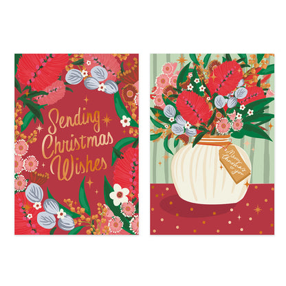 Two Christmas greeting cards shown side by side on a white background. The left card has a red background with gold script reading 'Sending Christmas Wishes' and is decorated with floral and bird illustrations.