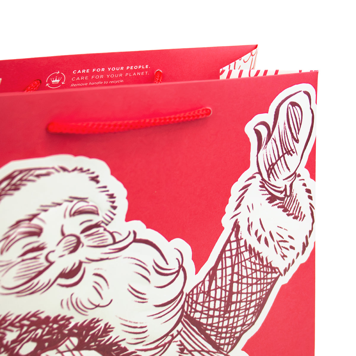 A red Christmas-themed paper shopping bag with white printed artwork of Santa Claus and red rope handles, photographed against a white background.