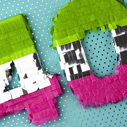 Hallmark Signature 40th Birthday Card (Never Looked So Good) close-up of 3D piñata numbers 40 in green and pink on blue foil background.