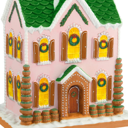 Gorgeous Gingerbread House, Porcelain — 2026 Hallmark Keepsake Christmas Ornament, side view featuring pink walls and green roof.