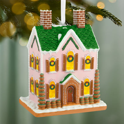 Gorgeous gingerbread house, porcelain — 2026 Hallmark Keepsake Christmas Ornament featuring a pink, two-storey design with green roof and holiday wreaths.
