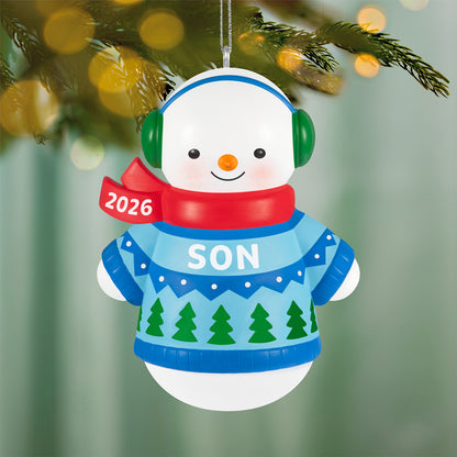 Son Snowman 2026 — 2026 Hallmark Keepsake Christmas Ornament featuring a smiling snow-boy in a blue sweater with a red scarf, hanging on a tree.