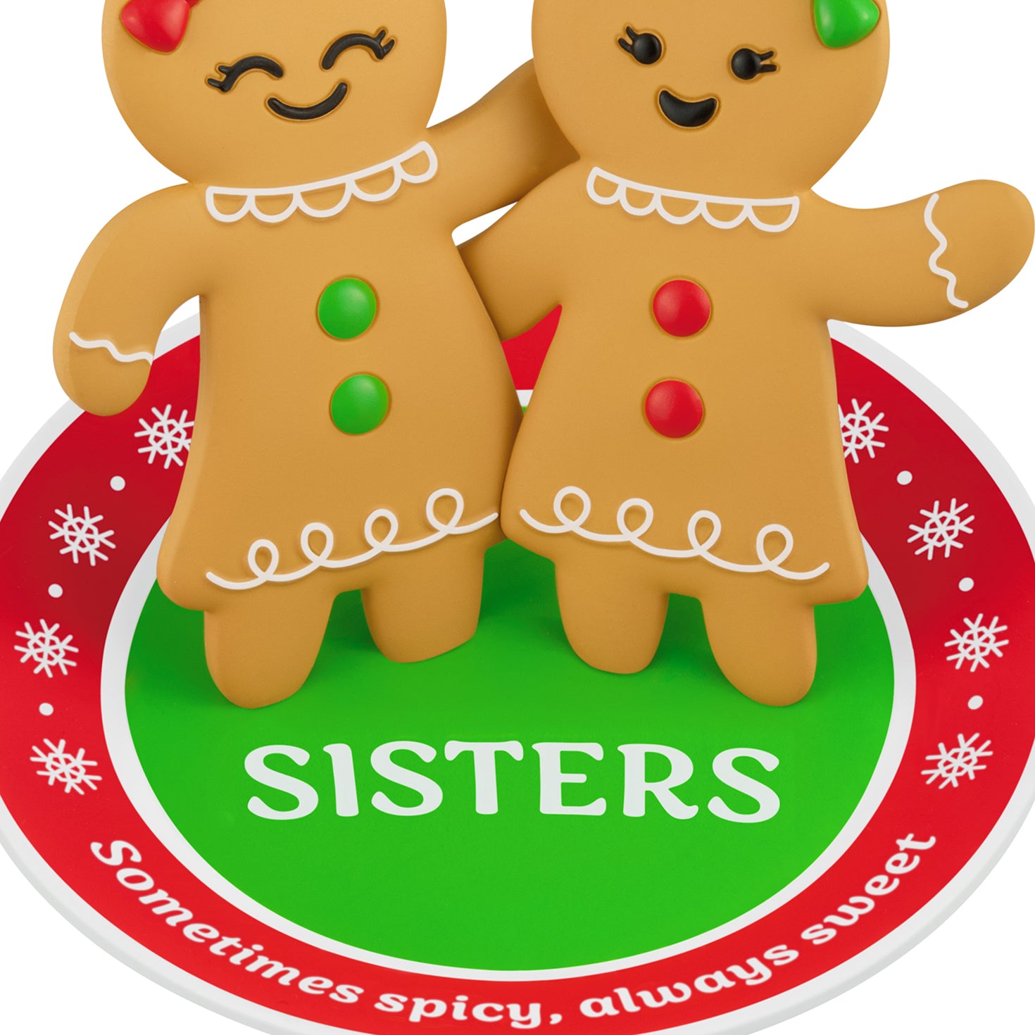 Sweet and Spicy Sisters — 2026 Hallmark Keepsake Christmas Ornament featuring whimsical gingerbread girls with buttons standing on a festive rug.