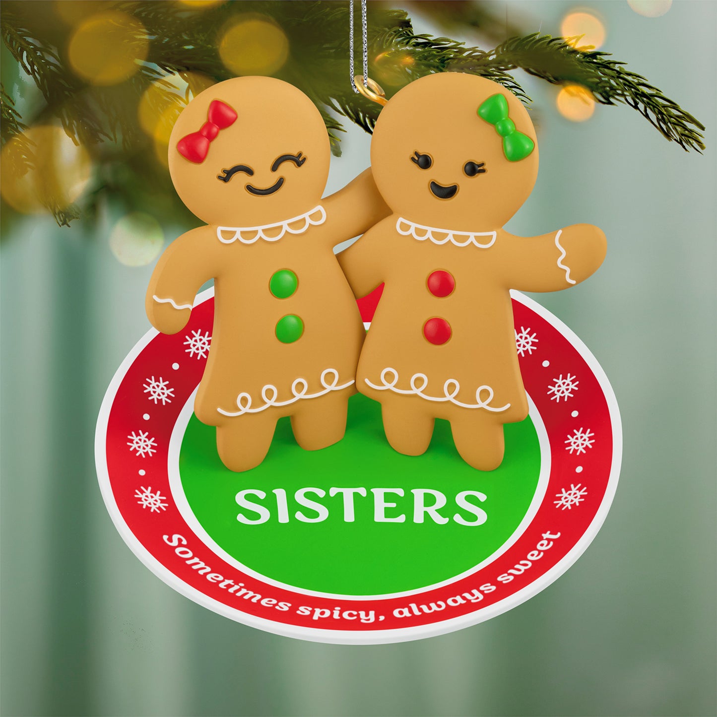 Sweet and Spicy Sisters — 2026 Hallmark Keepsake Christmas Ornament featuring two gingerbread girls with red and green buttons.