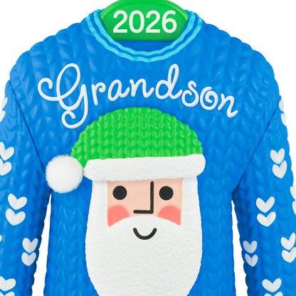 Grandson Santa Sweater 2026 — 2026 Hallmark Keepsake Christmas Ornament, blue sweater with white hearts and Santa face detail, close up view.