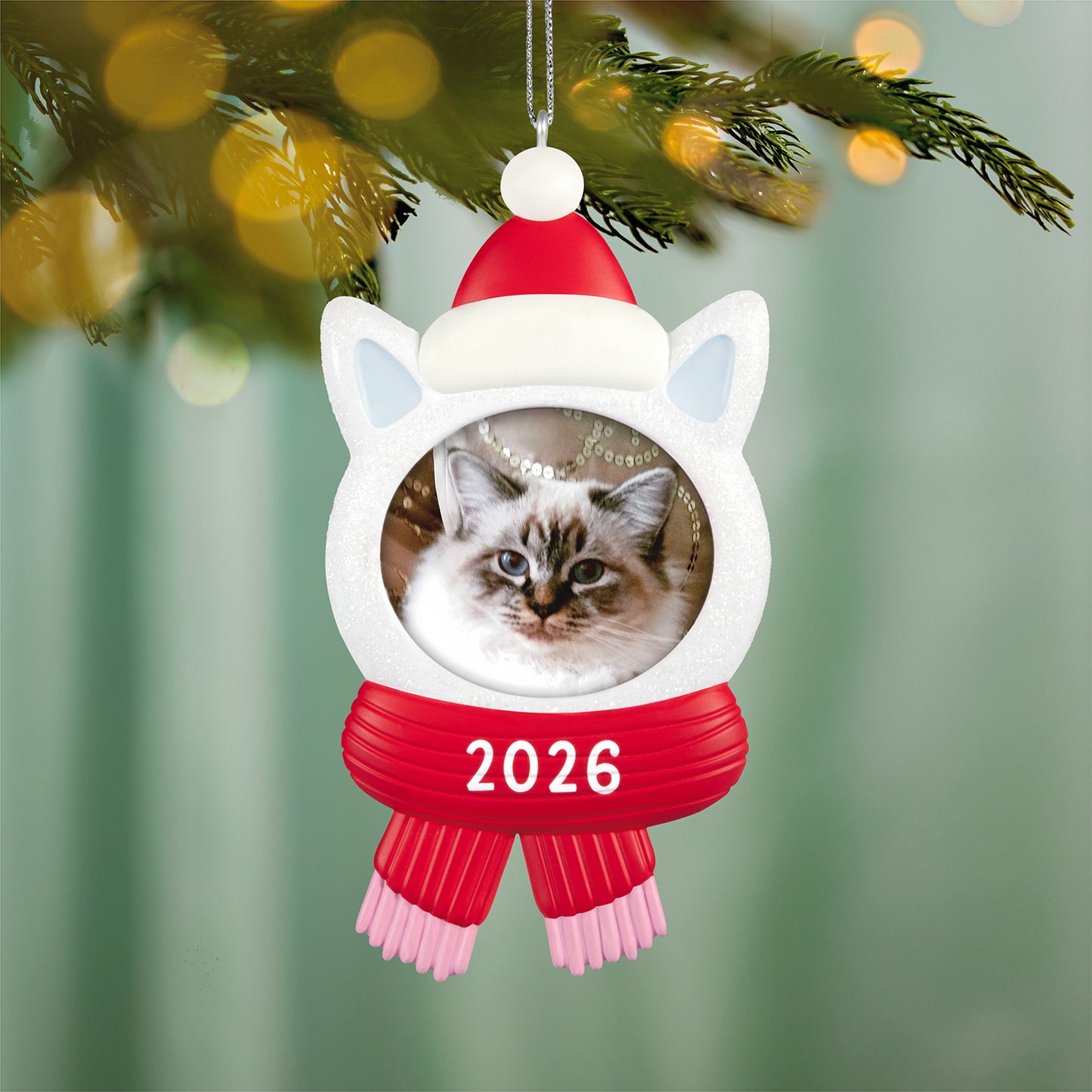 Snow Cat 2026 photo frame — 2026 Hallmark Keepsake Christmas ornament featuring a sparkly kitty head with a red hat and scarf, close-up view.