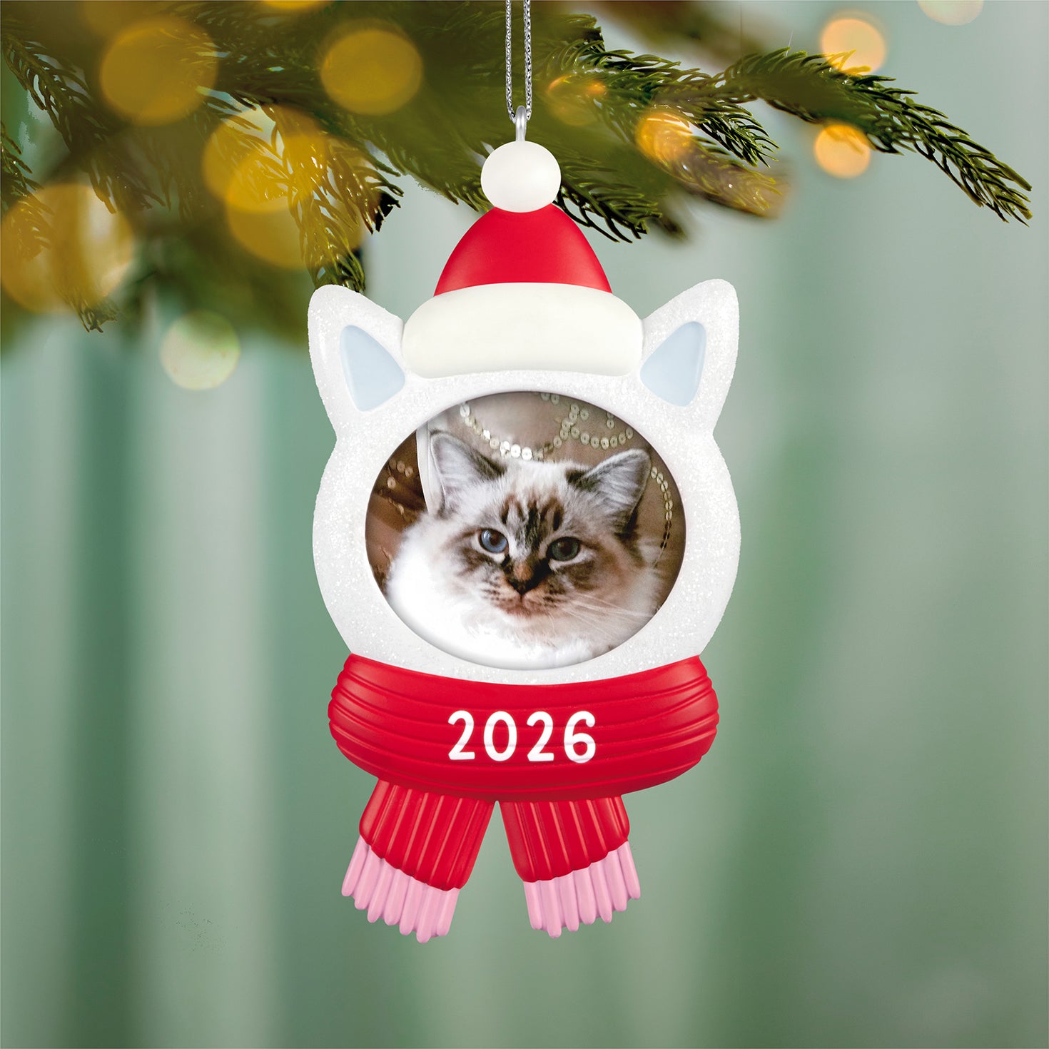 Snow Cat 2026 photo frame — 2026 Hallmark Keepsake Christmas ornament featuring a sparkly kitty head with a red hat and scarf, close-up view.