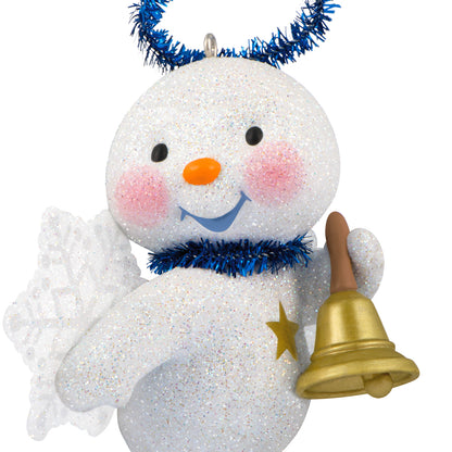 Cute Snow Angel With Bell — 2026 Hallmark Keepsake Christmas Ornament features a glittery snowman with snowflake wings, rosy cheeks and a gold bell.