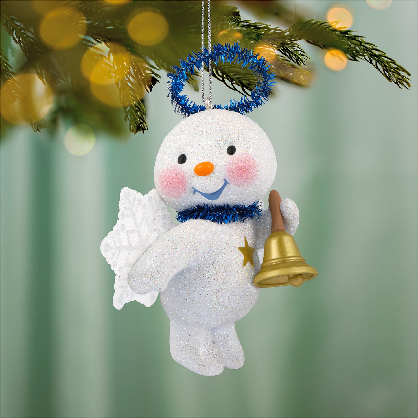 Cute snow angel with bell — 2026 Hallmark Keepsake Christmas ornament, featuring a glittery snowman with snowflake wings and a gold bell, close-up.
