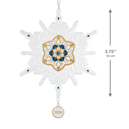 Snowflake 2026, porcelain — 2026 Hallmark Keepsake Christmas Ornament featuring blue and gold accents with a 2026 charm, flat lay.