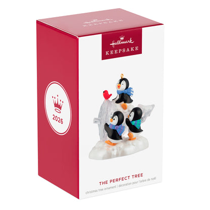 The Perfect Tree — 2026 Hallmark Keepsake Christmas Ornament in gift box featuring playful penguins and a red bird.