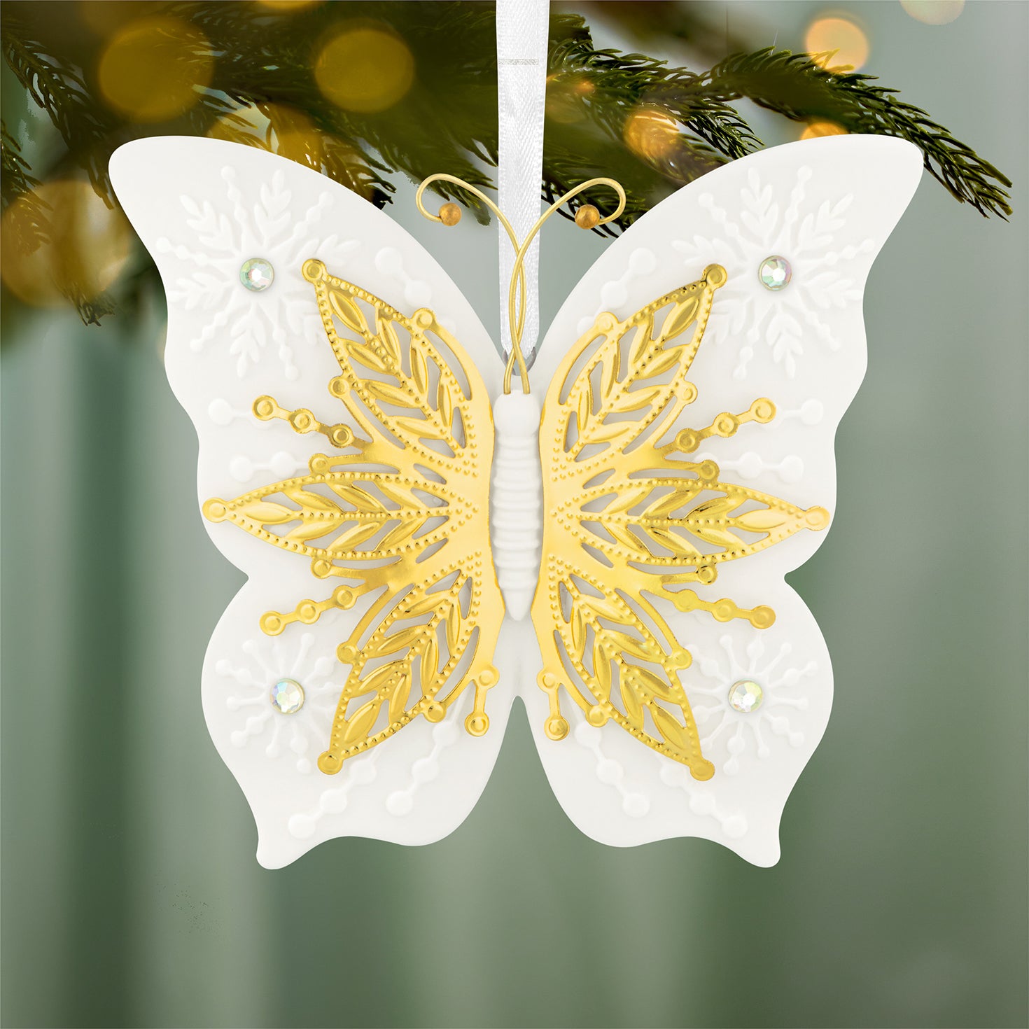 10th Anniversary Brilliant Butterflies, Porcelain and Metal — 2026 Hallmark Keepsake Christmas Ornament featuring gold metal and detailed snowflake designs in white.