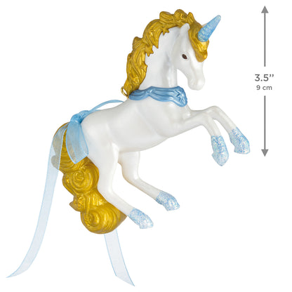 Celestial Unicorn — 2026 Hallmark Keepsake Christmas Ornament, white unicorn with gold mane, ribbon bow, and glittery hooves, angled view.