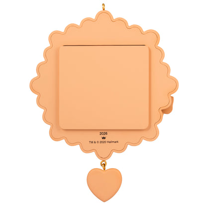 My Very First Christmas 2026 Photo Frame — 2026 Hallmark Keepsake Christmas Ornament in light peach, featuring a heart dangle and smooth surface.
