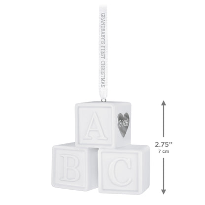 Grandbaby's First Christmas Blocks 2026, porcelain ornament with toy alphabet blocks and a silver heart detail, measuring 7 cm.