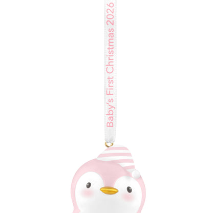 Baby girl's first Christmas penguin 2026 Christmas ornament in pink and white with a striped hat and commemorative ribbon detail.