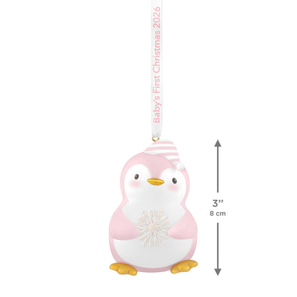 Baby girl's first Christmas Penguin 2026 ornament in pink and white with striped hat and snowflake detail, measuring 8 cm.