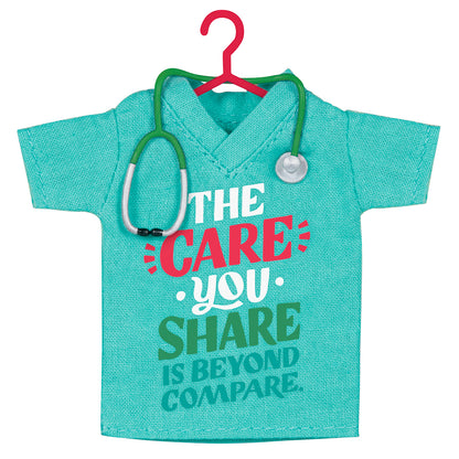 The Care You Share, Fabric — 2026 Hallmark Keepsake Christmas Ornament, teal fabric scrubs shirt with stethoscope detail, front view