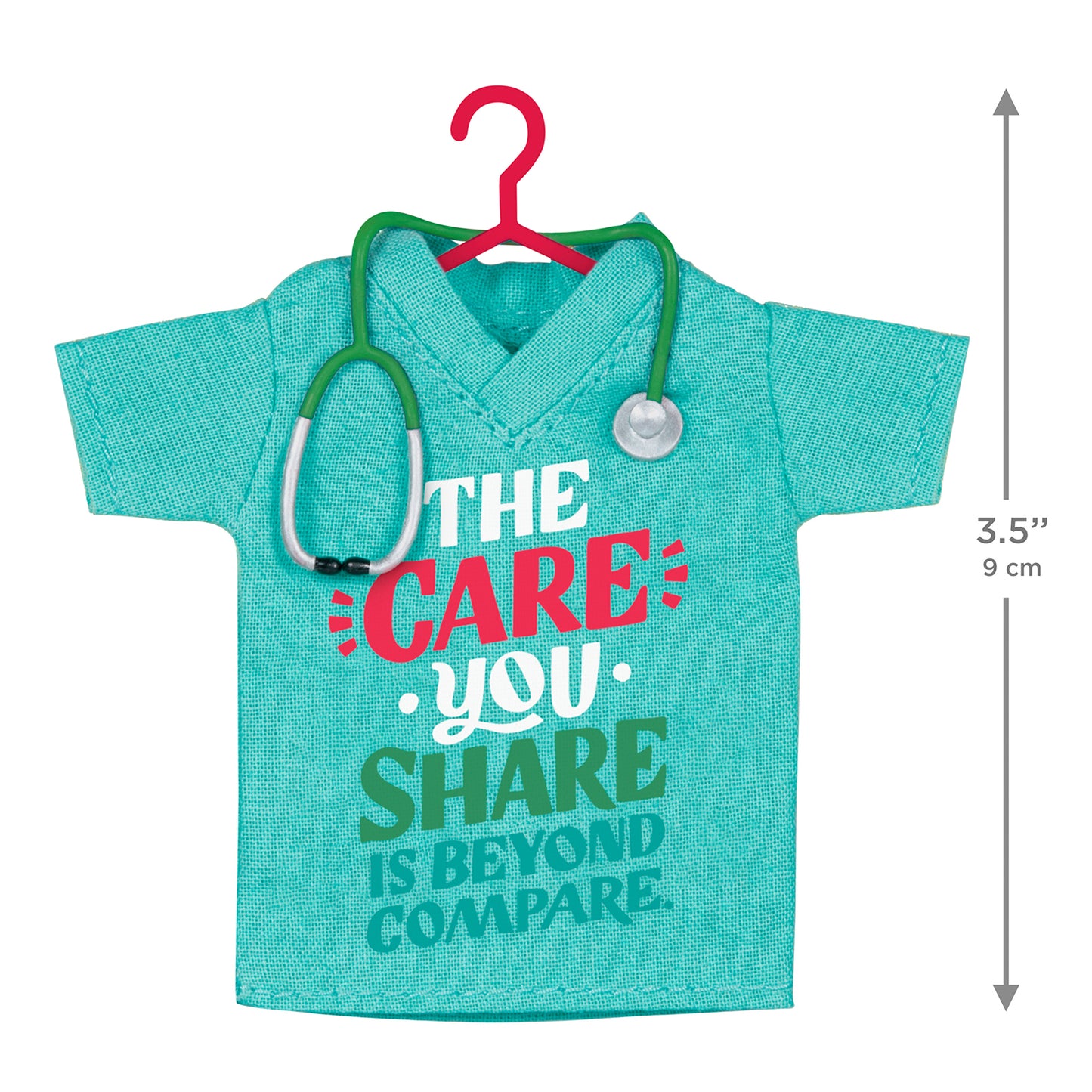 The Care You Share, Fabric — 2026 Hallmark Keepsake Christmas Ornament featuring a teal scrubs shirt with stethoscope detail in flat lay view.