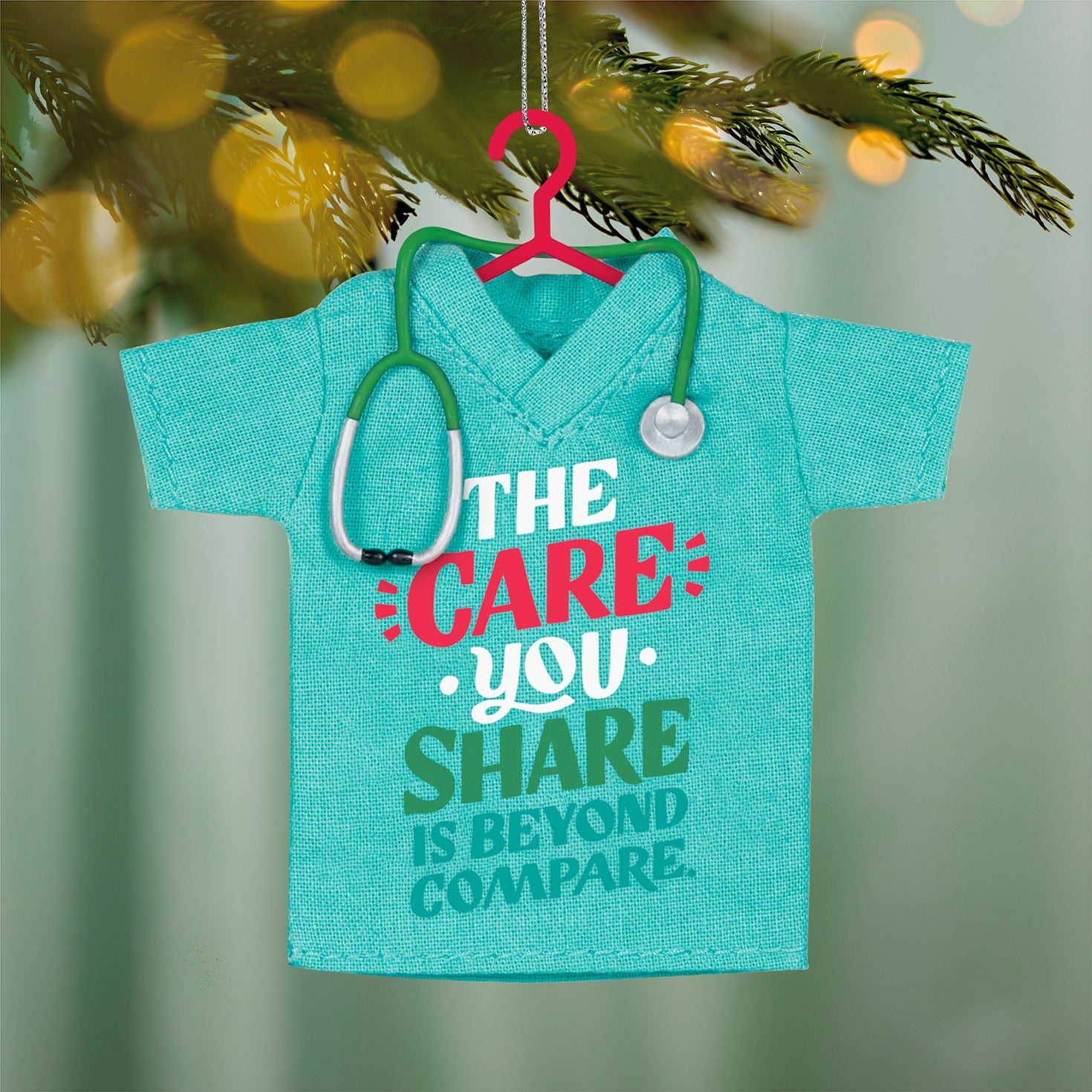 The Care You Share, Fabric — 2026 Hallmark Keepsake Christmas Ornament in teal fabric, featuring a stethoscope and gratitude message, close up view.