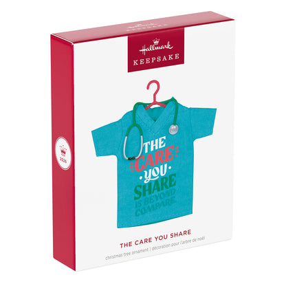 The Care You Share, Fabric — 2026 Hallmark Keepsake Christmas Ornament in packaging featuring teal scrubs and stethoscope.