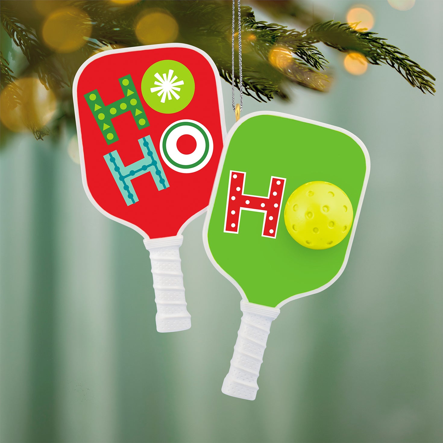Merry Pickleball — 2026 Hallmark Keepsake Christmas Ornament features two festive pickleball paddles with vibrant colours, hanging on a tree.
