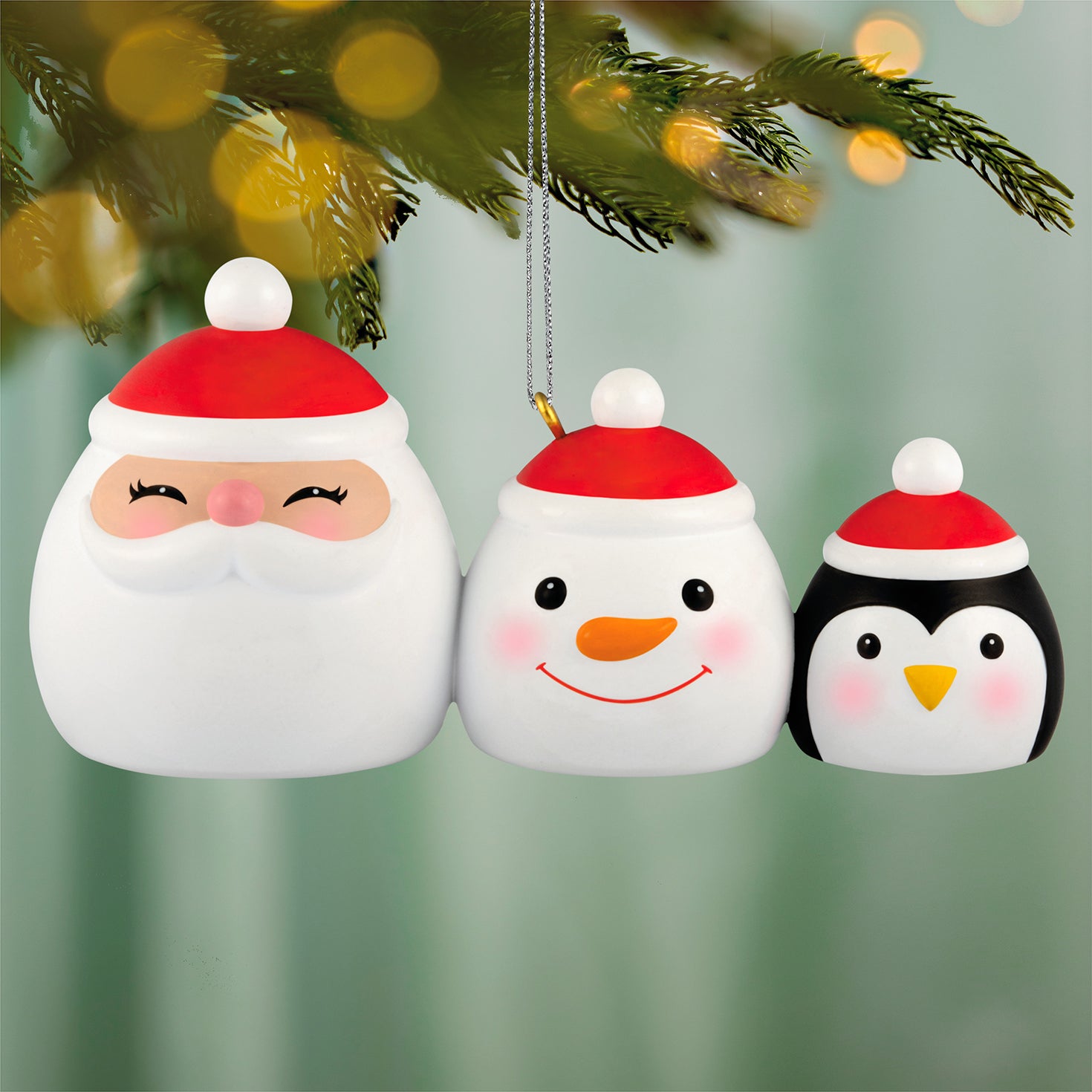 The Makings of Merry — 2026 Hallmark Keepsake Christmas Ornament featuring Santa, snowman and penguin canisters with red hats, close up view.