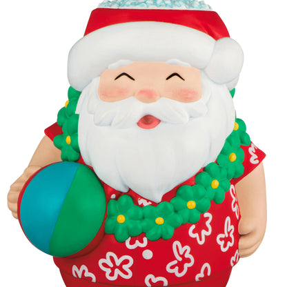 Seasons Tiki-ngs Santa — 2026 Hallmark Keepsake Christmas Ornament, colourful Santa in a Hawaiian shirt with beach ball, close up view.