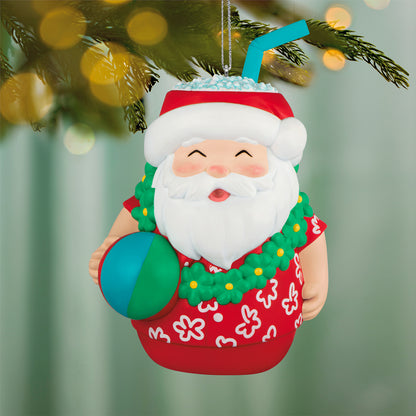 Seasons Tiki-ngs Santa — 2026 Hallmark Keepsake Christmas Ornament, colourful tiki design, smiling Santa with a beach ball and straw, angled view