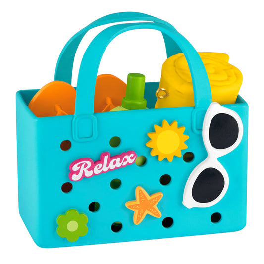 Relaxing at the Beach — 2026 Hallmark Keepsake Christmas Ornament, colourful beach bag featuring flip-flops, towel, and sunscreen, flat lay