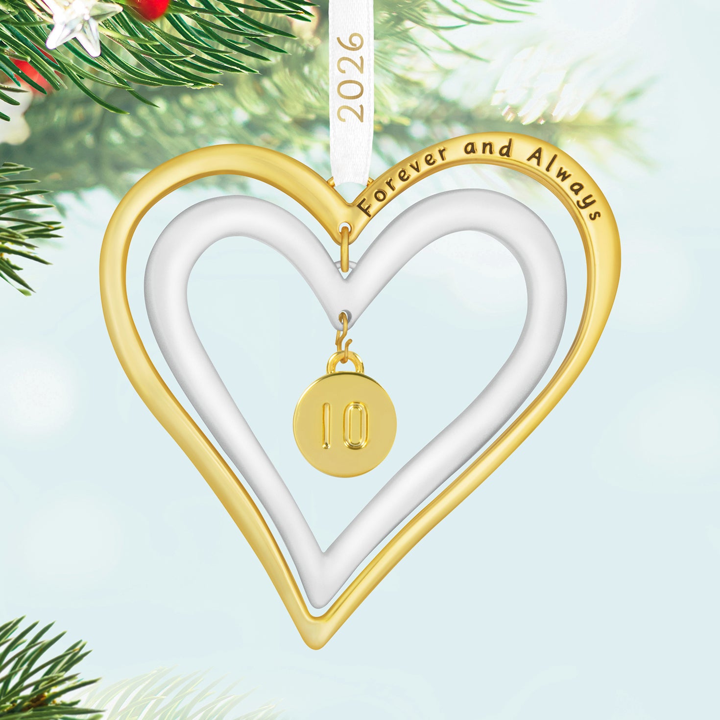 Our Anniversary 2026, Metal — 2026 Hallmark Keepsake Christmas Ornament featuring double hearts in gold and white with a gold charm.