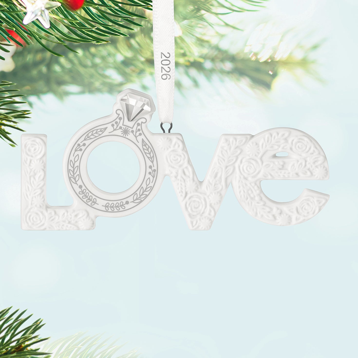 Our Engagement 2026, Porcelain — 2026 Hallmark Keepsake Christmas Ornament featuring textured floral 'Love' design and engagement ring detail.