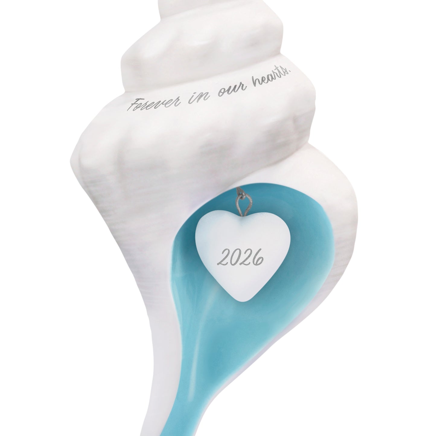Forever in our hearts shell 2026, porcelain ornament with sea-blue interior and heart charm detail.