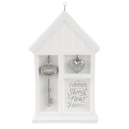 Home Sweet New Home 2026, porcelain and metal ornament featuring a house shape, silver key, and heart charm for Christmas.