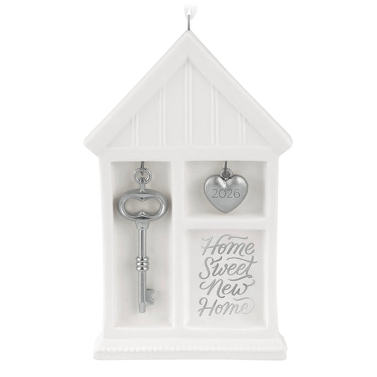 Home Sweet New Home 2026, porcelain and metal ornament featuring a house shape, silver key, and heart charm for Christmas.