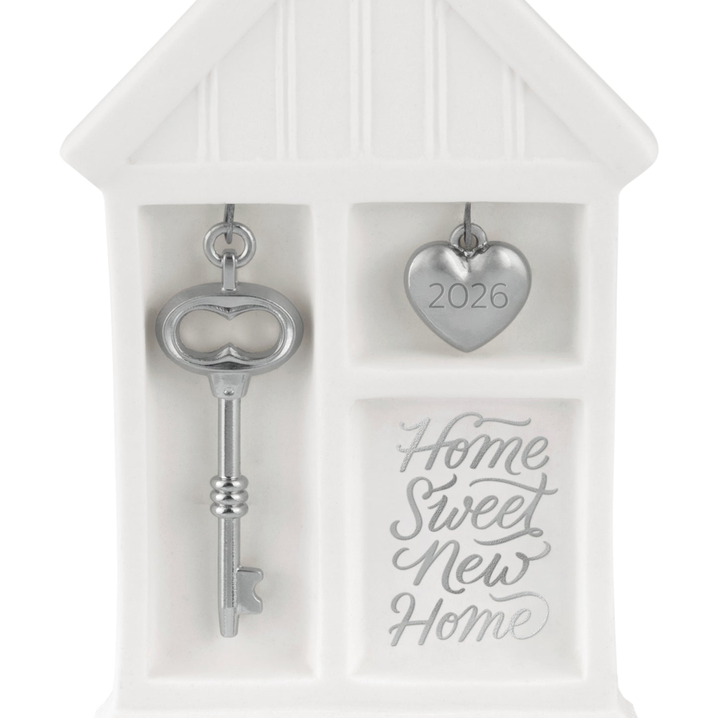 Home Sweet New Home 2026, porcelain and metal ornament featuring a silver key and heart charm, detailed close-up view.