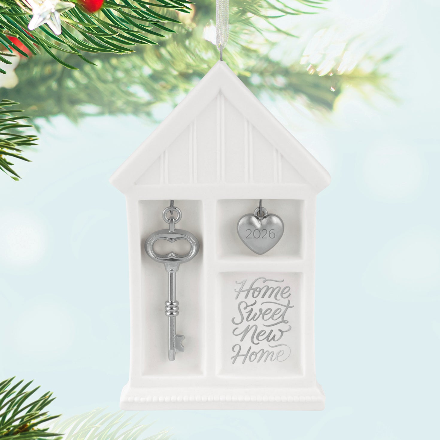 Home Sweet New Home 2026, porcelain and metal — 2026 Hallmark Keepsake Christmas ornament, featuring a silver key and year-dated heart charm.